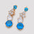 CR Charrm Aretes Azul Celestial, Alloy