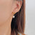 CR Charms Aretes Lazo Radiante con Perlas, Acero