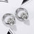 CR Charms Aretes Calaveras Plateadas, Acero